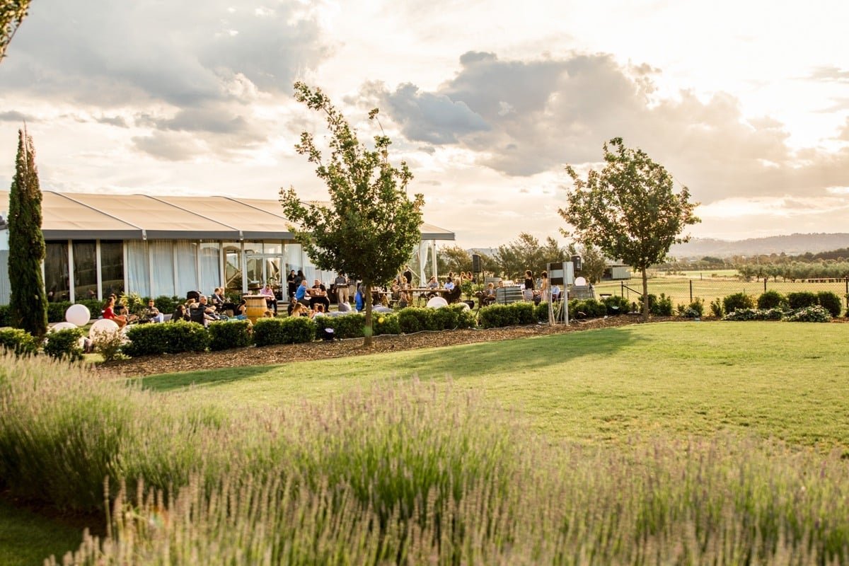 Pialligo Estate lawn and glass pavilion during an outdoor event