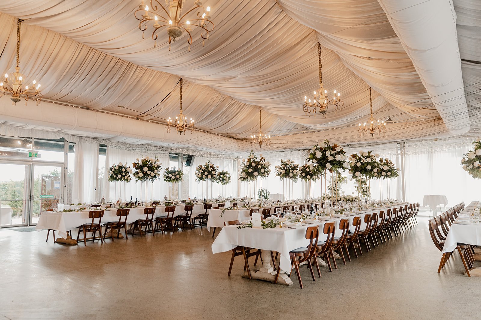 Long tables set for a wedding inside the Pialligo Estate reception space